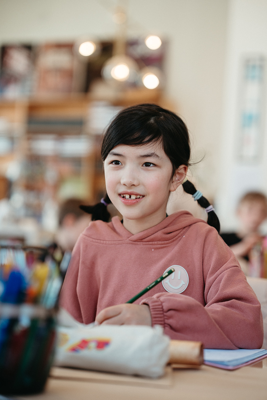 Young writer with a pencil and notebook in a welcoming creative space