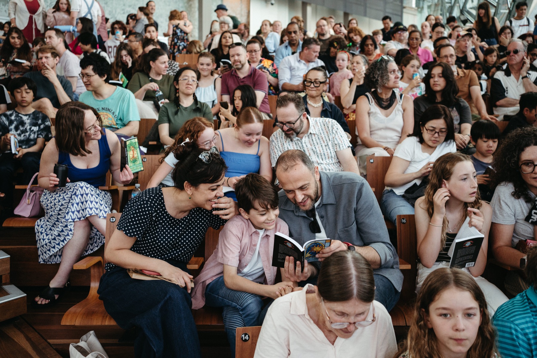 Young writers and families celebrating published stories at a Story Studios book launch